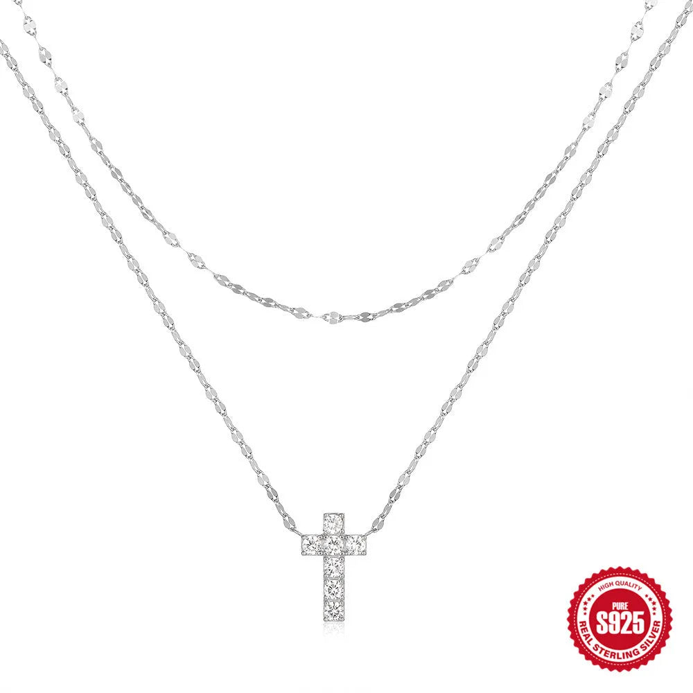 S925 sterling silver double layer cross pendant necklace with twin diamond details on a clavicle chain.
