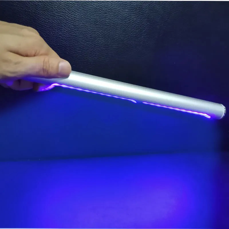 Silver handheld UV disinfection stick on white background, USB rechargeable, 20x300mm, PC aluminium construction
