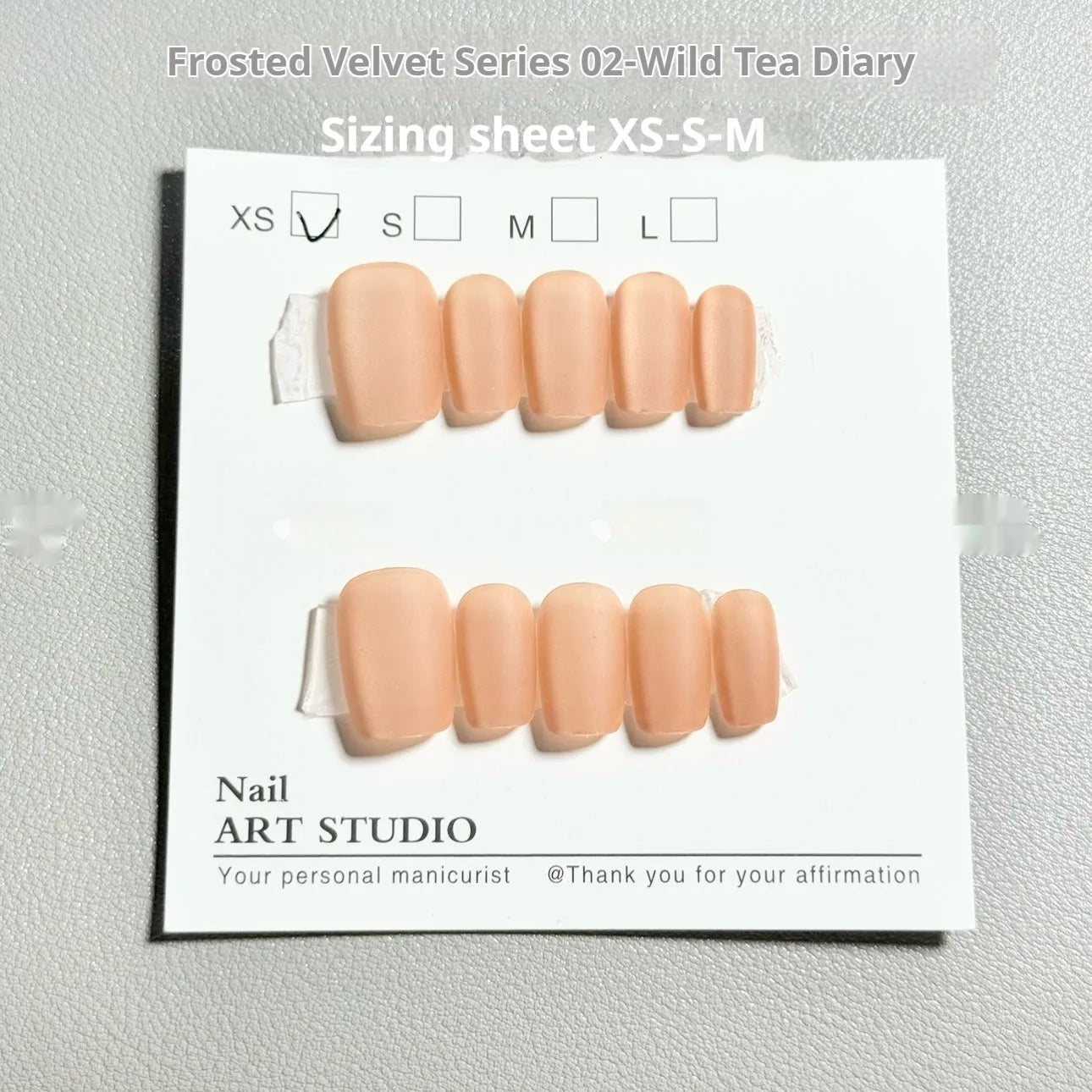 Set of velvet frosted Cat's Eye false nails with Aurora armour effect, showing short ladder sizes XS, S, and M.