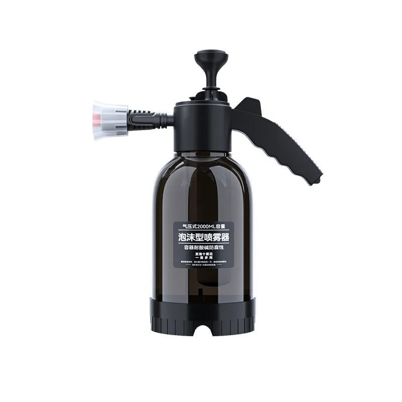 Black hand-held 2-litre multi-purpose sprayer with ergonomic handle and two nozzles