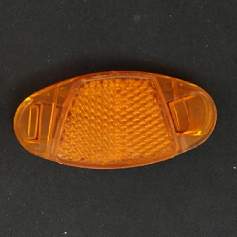 White and yellow plastic bicycle reflector stickers for spoke mounting measuring 7.2cm by 3.5cm