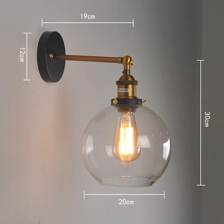 20cm round glass ball wall lamp in amber, smoke grey, or transparent on aluminium holder.