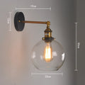 20cm round glass ball wall lamp in amber, smoke grey, or transparent on aluminium holder.