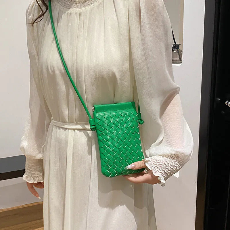 Vintage weave crossbody bag in retro style showing square vertical shape and woven texture