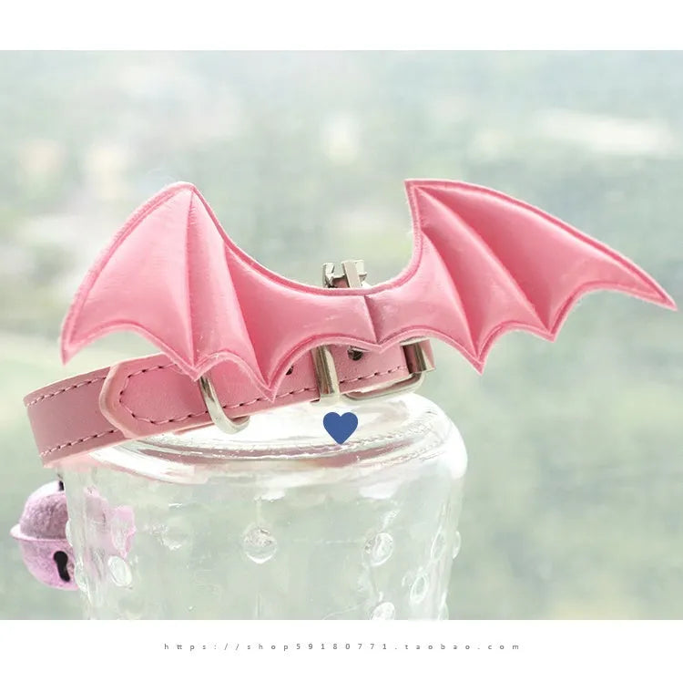 Small dog collar with devil wings and bell detail in patent leather satin material
