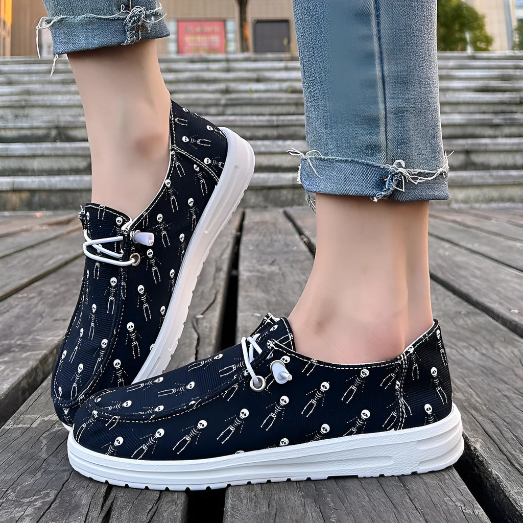 Women's black canvas low top casual shoes with soft sole, cloth lining, available in sizes 37 to 42