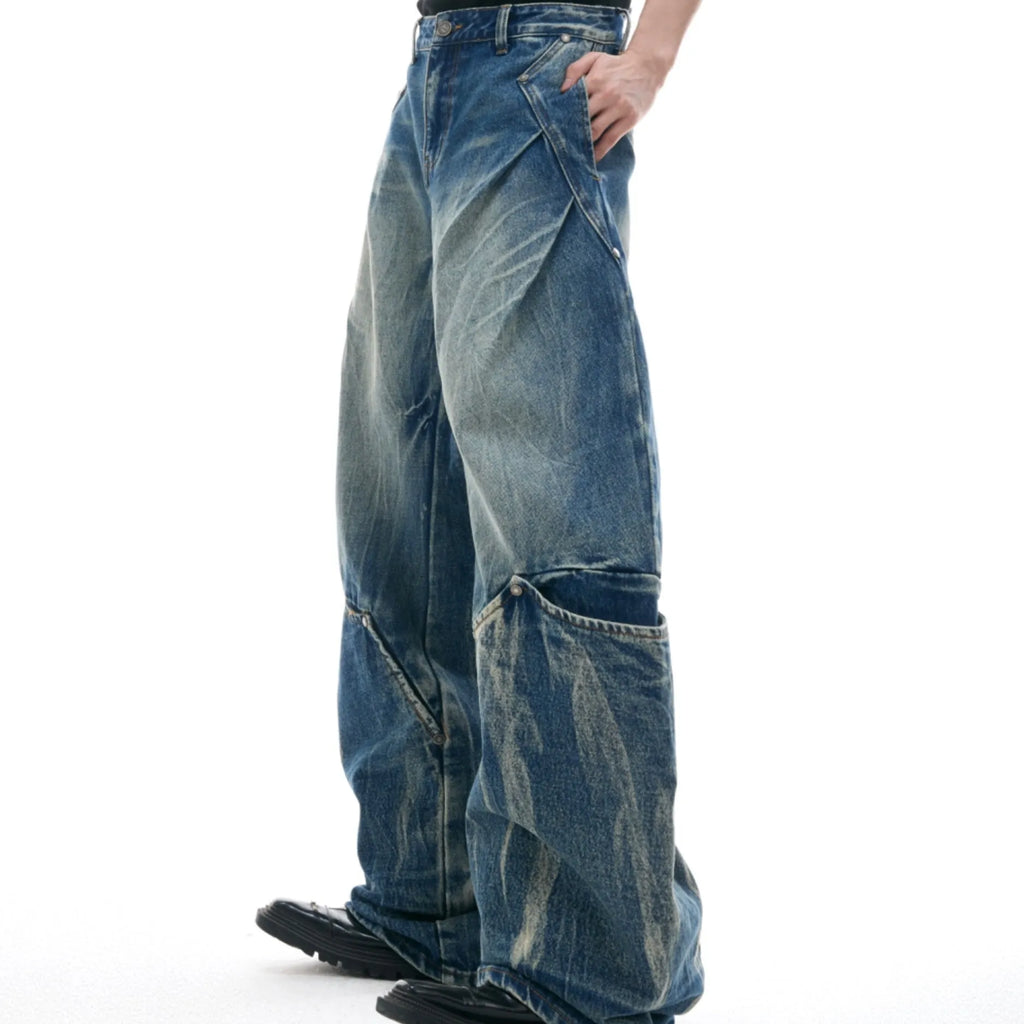 Men's verdant blue jeans with retro washed burst pattern and curved knife design on loose fit trousers