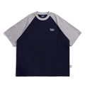 Man wearing a loose blue raglan sleeve casual t-shirt, Japanese style, thin polyester blend.