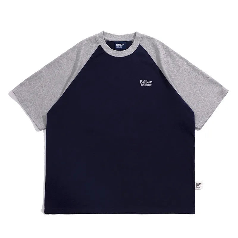 Man wearing a loose blue raglan sleeve casual t-shirt, Japanese style, thin polyester blend.