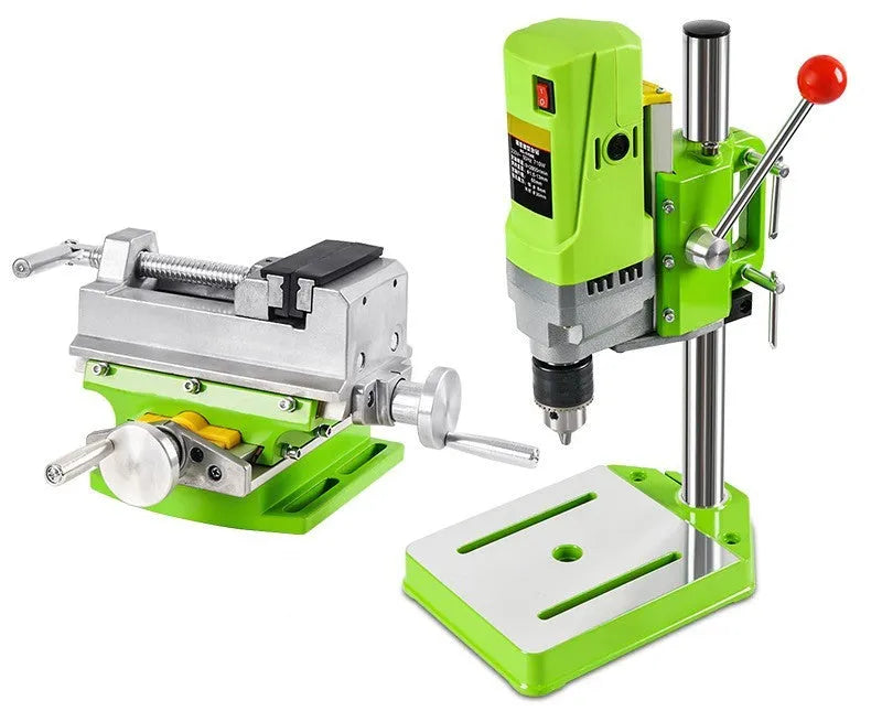 Mini bench drill and milling machine on a workbench with cross bench pliers and heavy-duty pliers.
