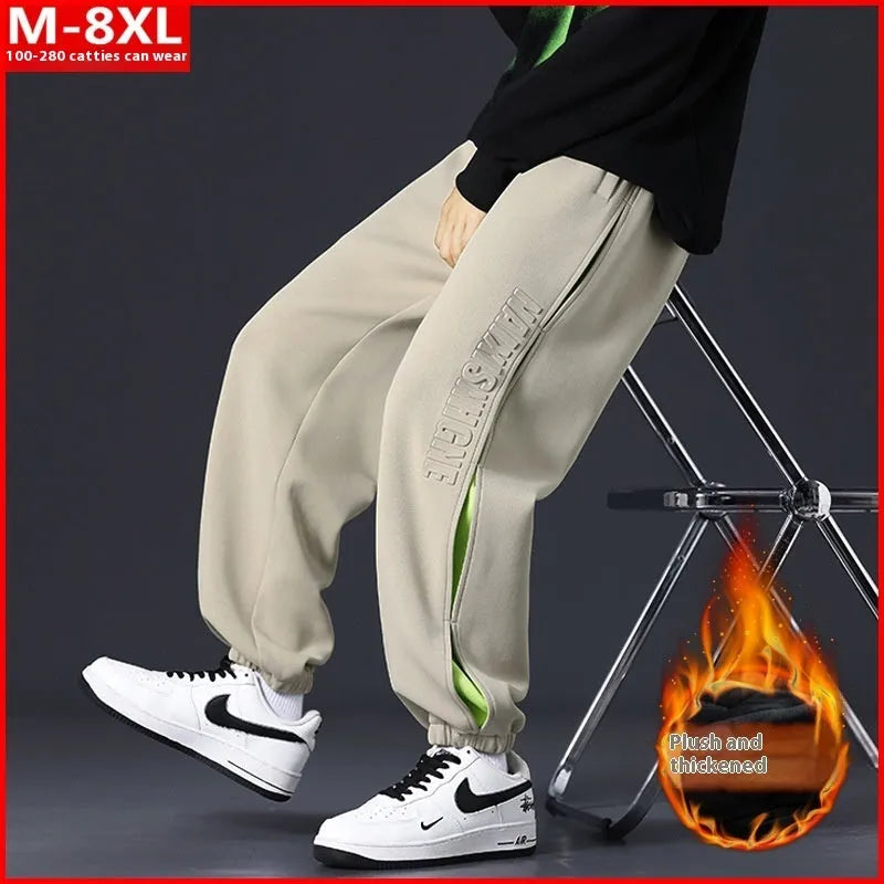Men's loose fit cotton casual trousers with stitching print design and banded ankle cuffs.