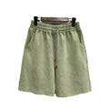 Men's distressed cotton casual shorts in loose straight fit showing fifth length measurement