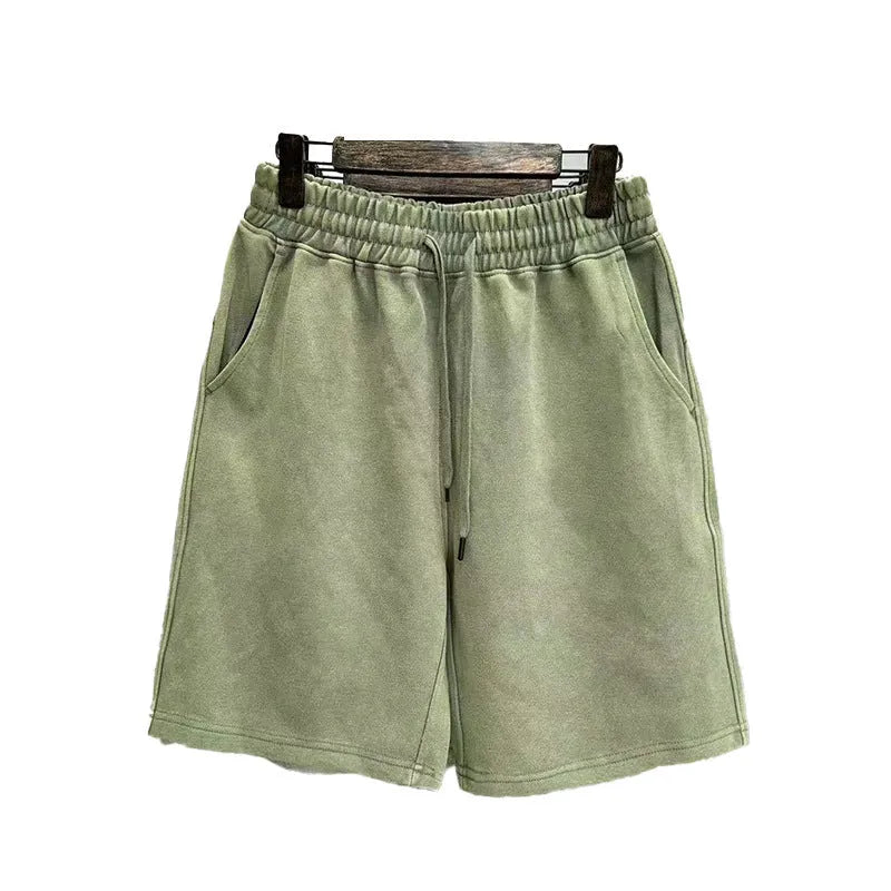 Men's distressed cotton casual shorts in loose straight fit showing fifth length measurement