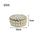 French gold iron frame crystal glass jewellery box with a metal lock closed.