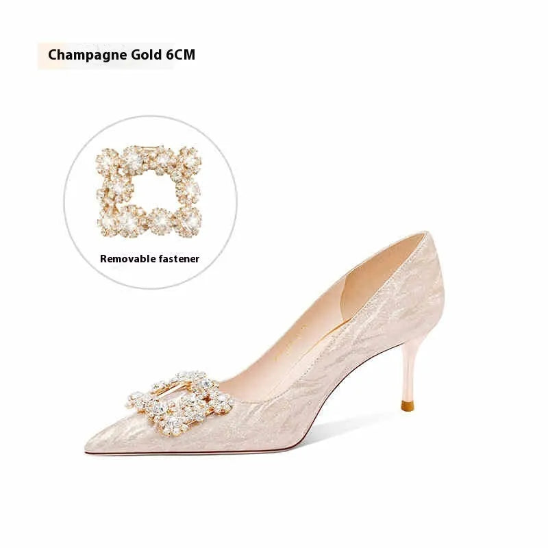Champagne gold pointed toe stiletto high heel pumps with slip-on closure on a plain background.