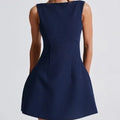 Women's slim-fit backless summer dress with sling straps in a selection of colours.