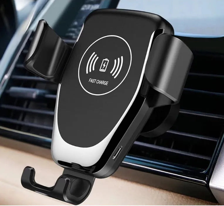 Black car wireless charger mounted on dashboard charging Apple iPhone with automatic clamp arms