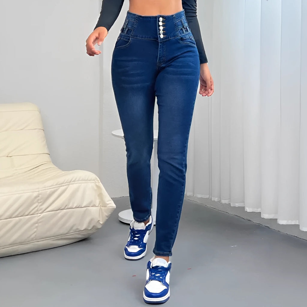 Women's dark blue straight-leg denim trousers with button details and street hipster style