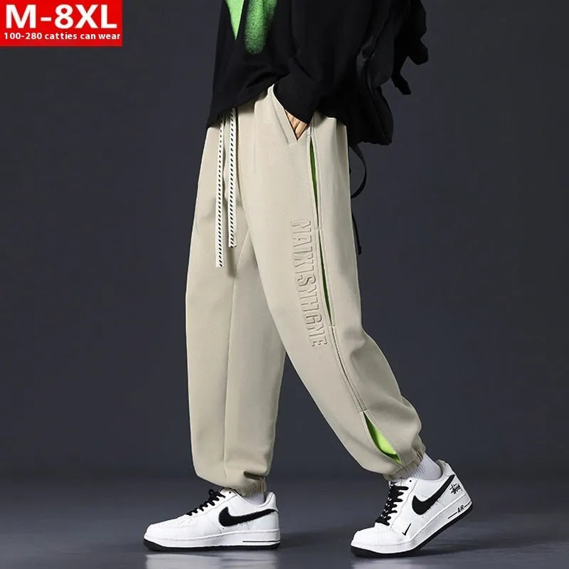 Men's loose fit cotton casual trousers with stitching print design and banded ankle cuffs.
