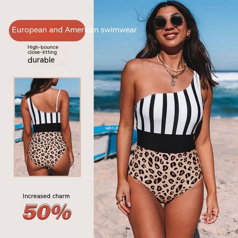 Women's leopard print one-piece swimsuit with asymmetric collar and high-waist briefs on a mannequin.