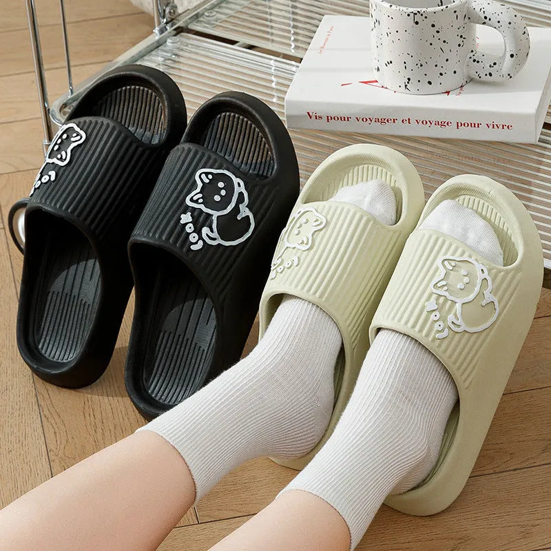 Women's pink cat-themed flip-flop slippers with a thick light blue EVA platform sole.