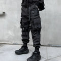 Men's black casual overalls loose fit binding hem trousers front view on mannequin