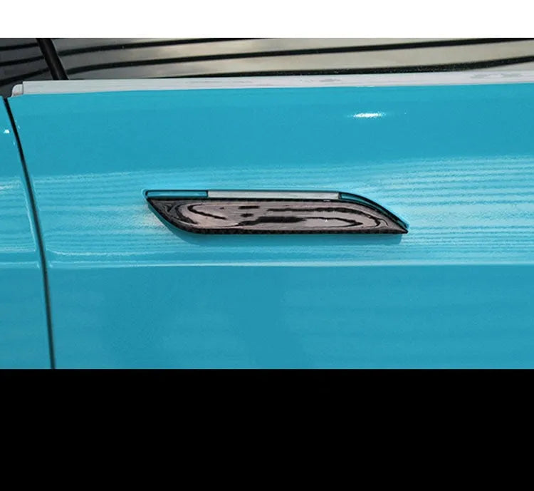 Set of four plain carbon fibre adhesive protection stickers for Tesla Model S door handles.