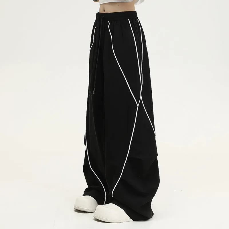 Black pleated hip hop trousers with wide legs and striped pattern