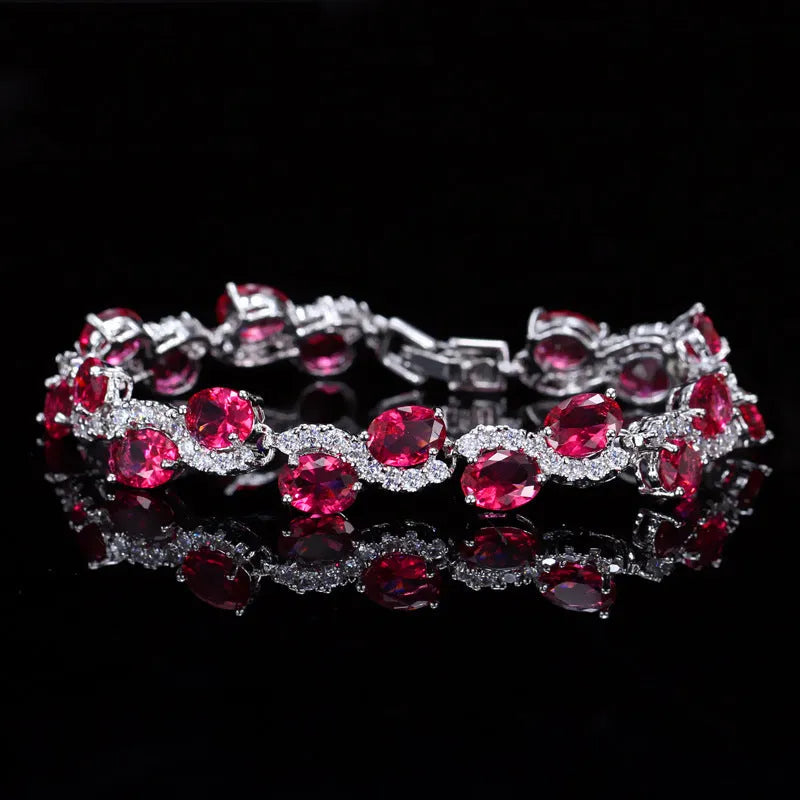 18K copper electroplated gold bracelet with AAA+ zircon stones in a simple geometric shape on a wrist.