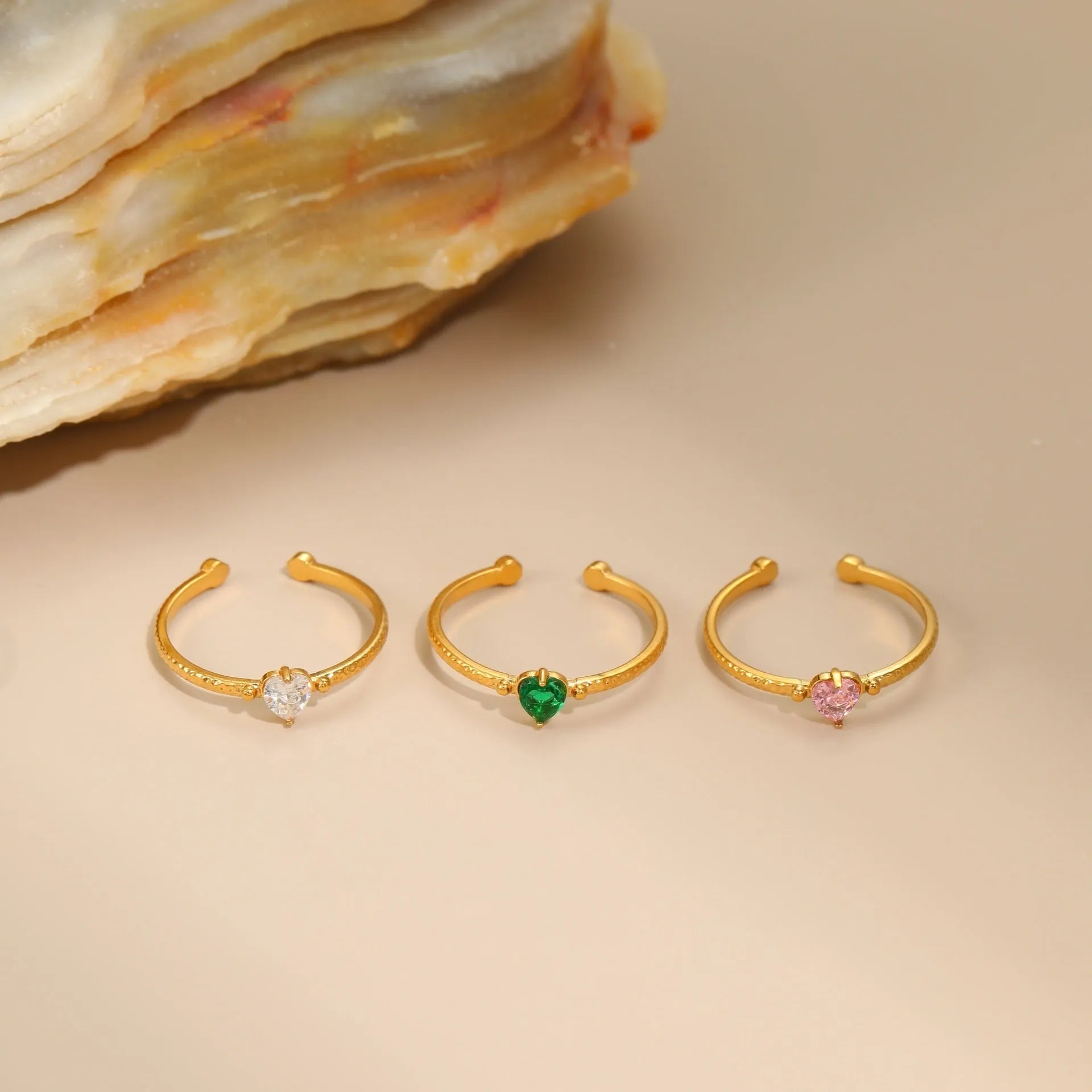 Open-ended stainless steel ring with heart-shaped zircon accents in adjustable free size design