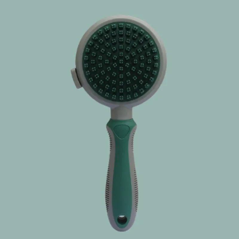 Green and pink dual-sided pet grooming brush showing slicker brush and silicone massager sides.