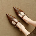 Brown women's pointed low-cut flat shoes with cowhide leather upper and a soft sole.