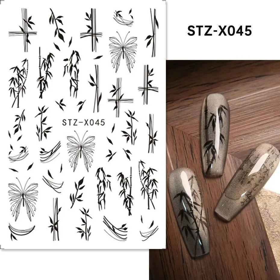 Pack of black and silver strip nail art stickers with cartoon and love pattern designs.
