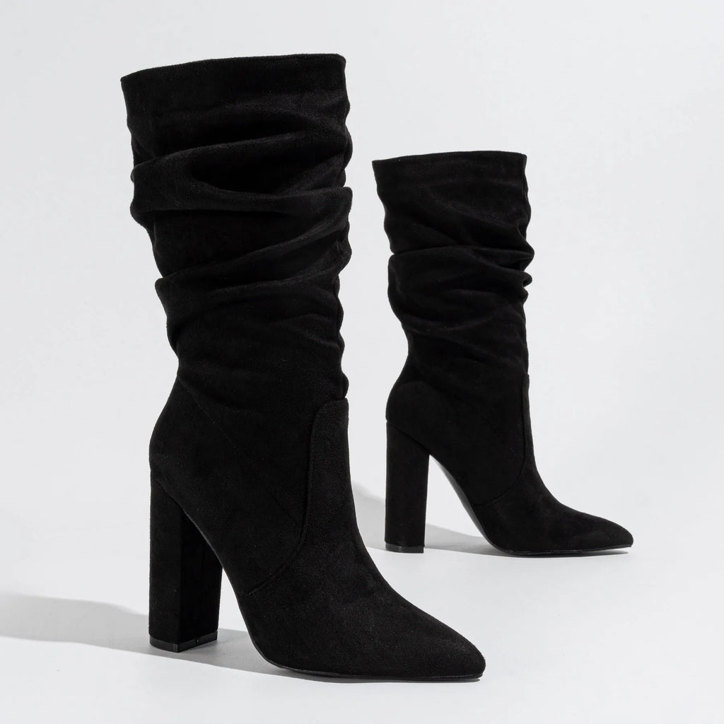 Women's black chunky heel pointed-toe suede boots with mid-calf length and oversleeve design