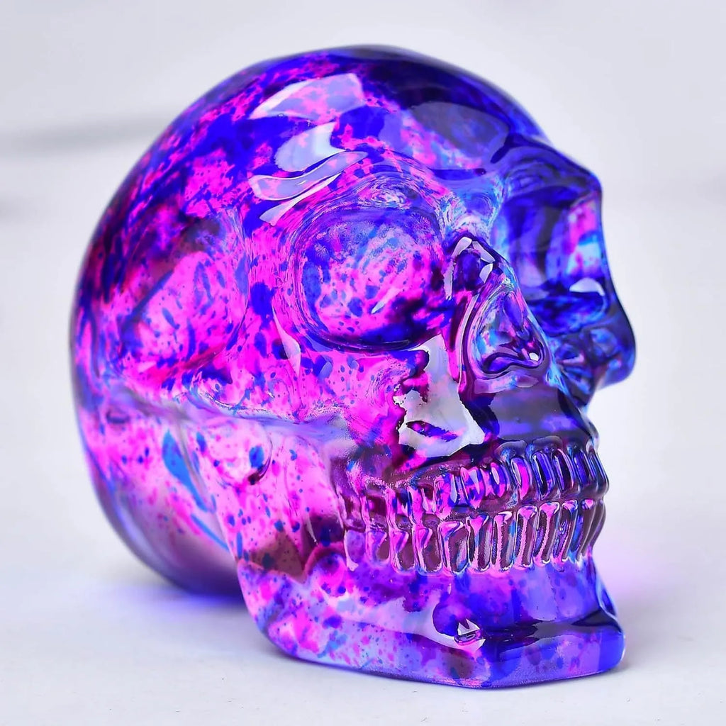Pink and blue floral skull ornament made of glass with hanging loop