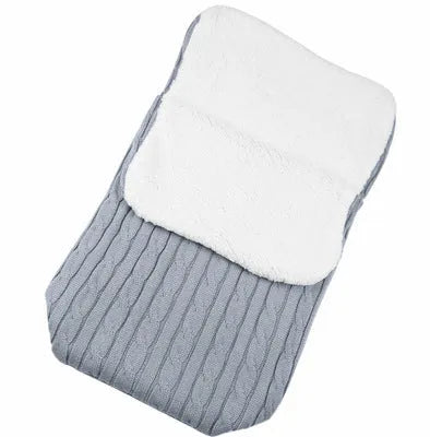 Envelope-style baby stroller sleeping bag in a choice of colours with cotton wool filling.
