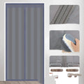 Full seam long magnetic strip cotton door curtain in grey diamond lattice pattern hanging in a doorway.