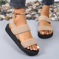 Women's flat wedge beach sandals with elastic band upper and EVA sole in median brown colour