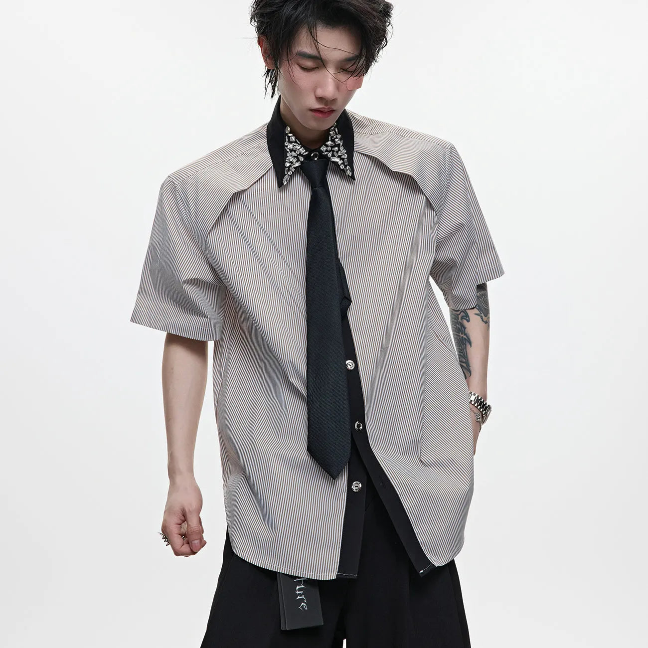 Man's blue patchwork striped shirt with a diamond tie front, quilted panels, and button decorations.