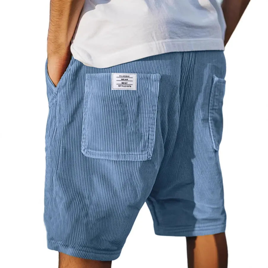 Men's grey straight-fit corduroy shorts with multiple pockets and a small embroidered logo on the leg.