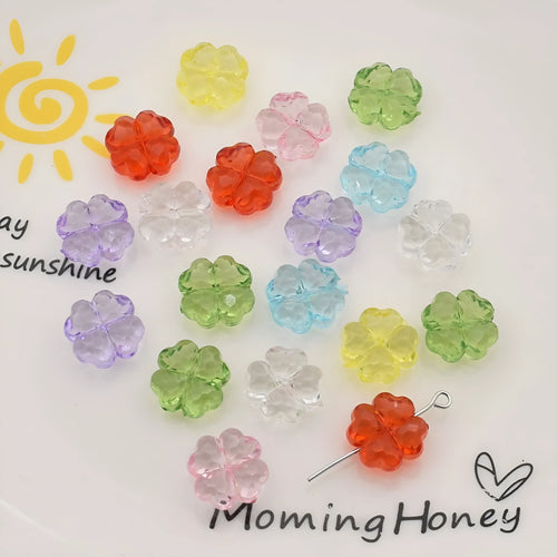 High transparency acrylic fat clover camellia beads scattered on white surface