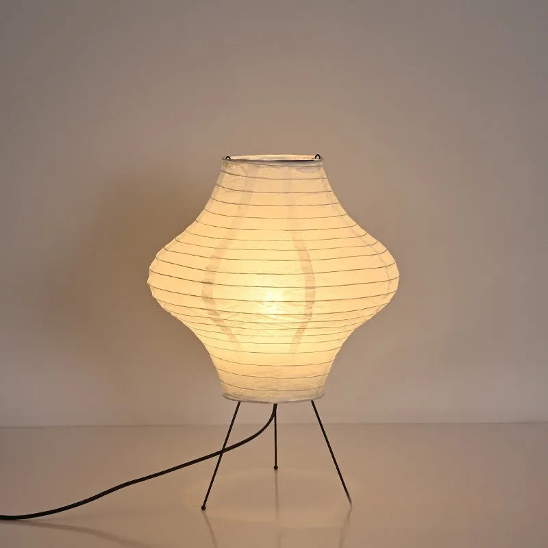 Japanese style decorative table lamp with a white Xuan paper shade on a wooden base.