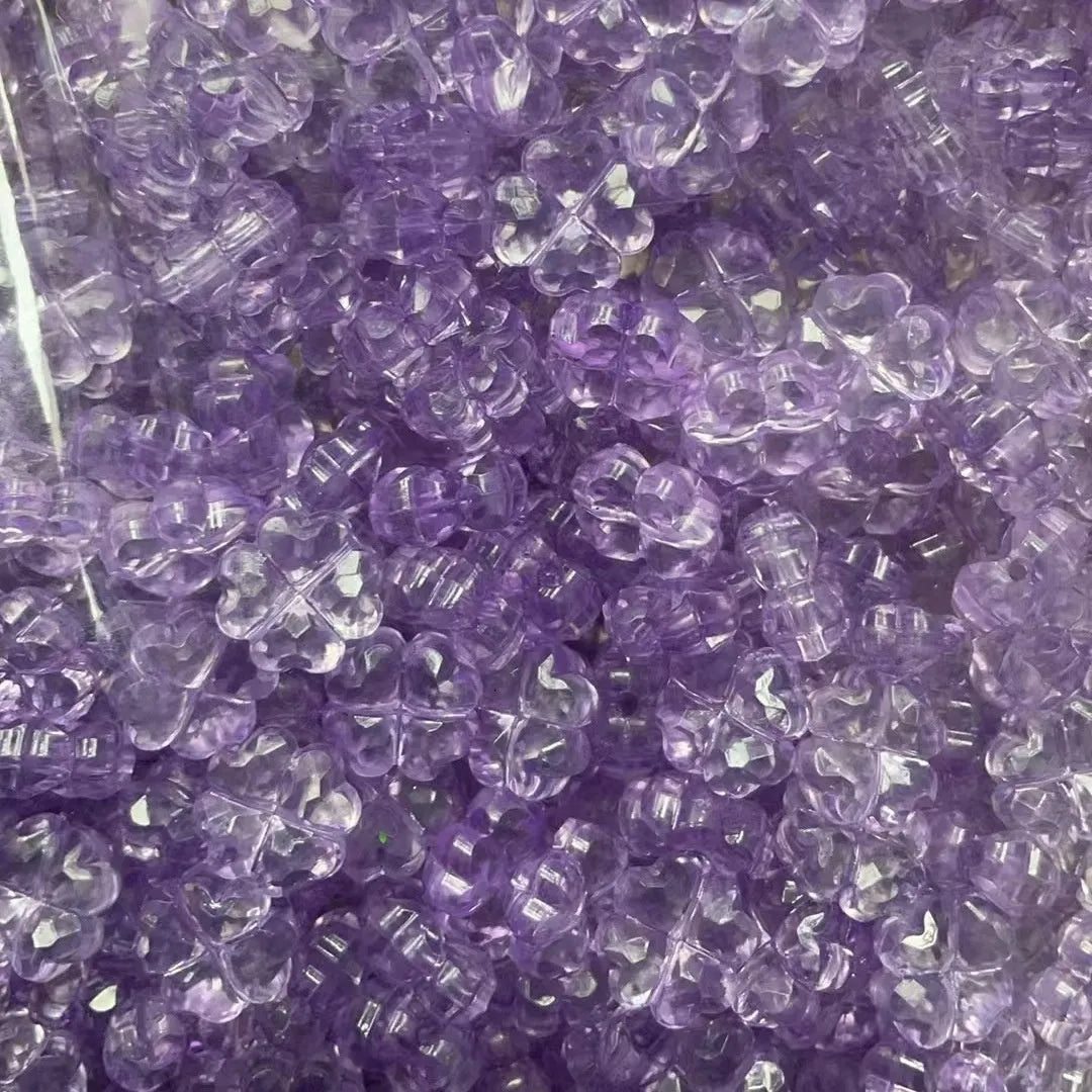 High transparency acrylic fat clover camellia beads scattered on white surface