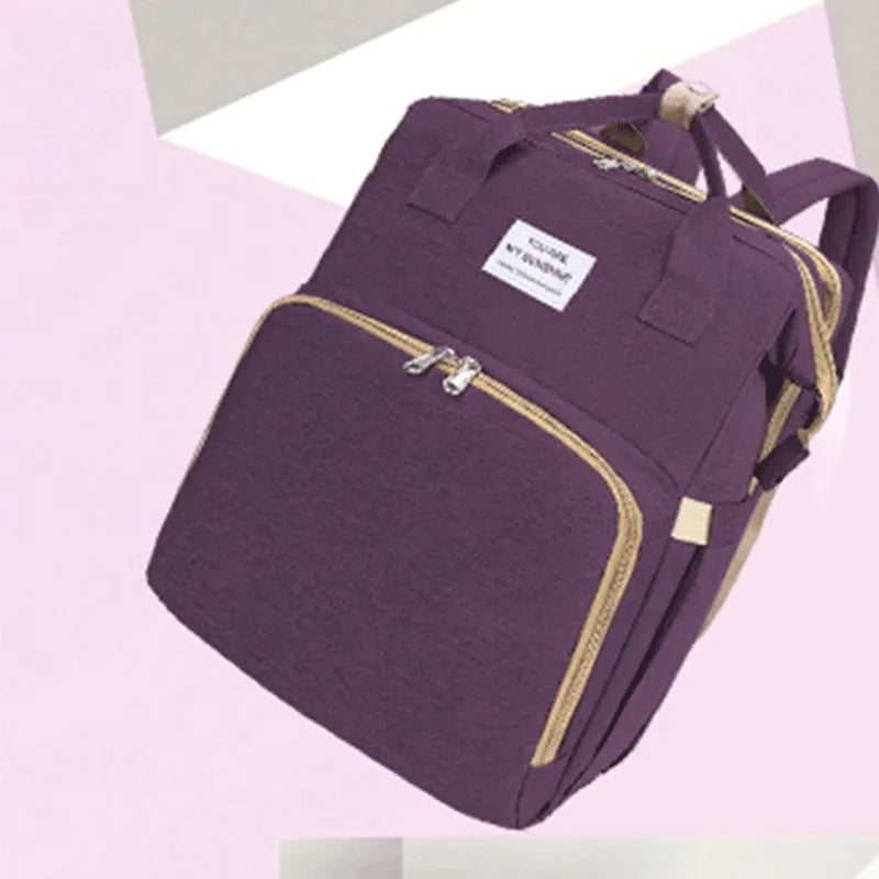 Portable lightweight nylon folding baby changing bag with USB port and shoulder strap in selected colour.