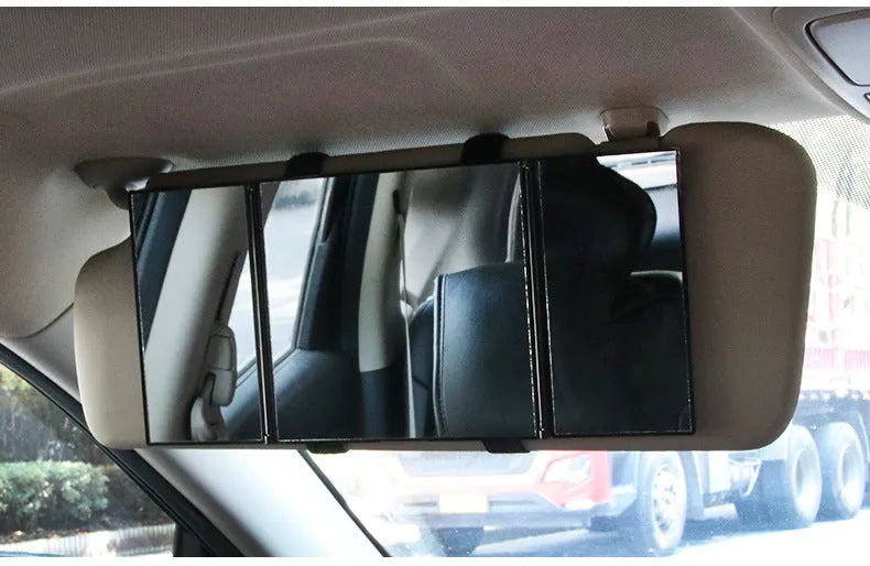 Silver car folding makeup mirror shown closed at 15.5x14cm and opened at 30.5x14cm.
