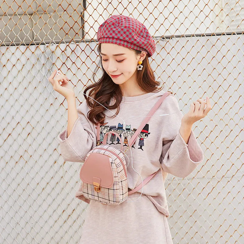 A one-shoulder diagonal phone bag made from PU fabric, shown in one of five colour options.