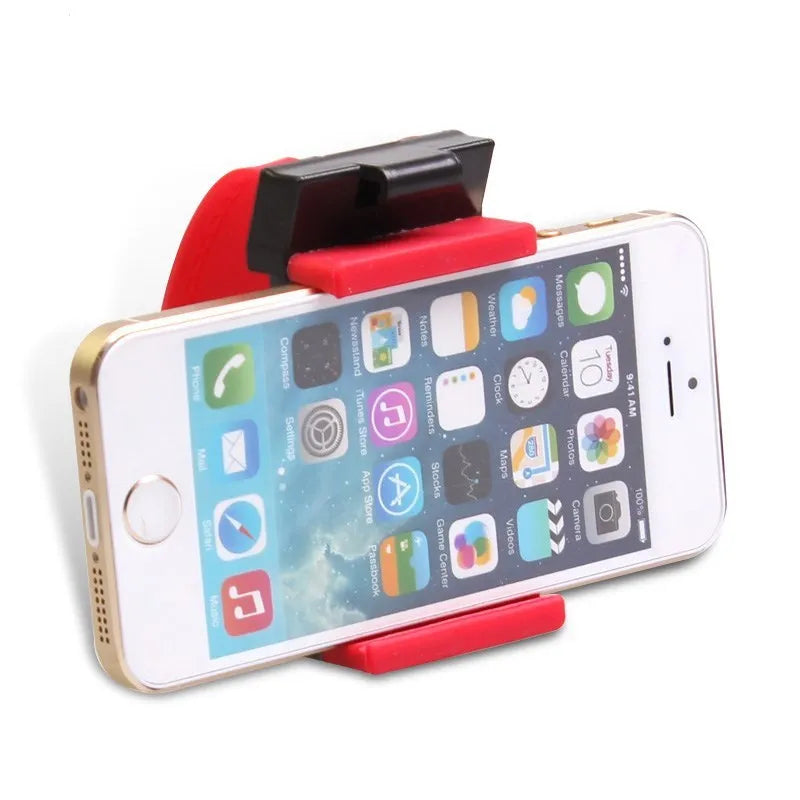 Black universal steering wheel phone holder clip mounted on a car steering wheel with a smartphone secured.