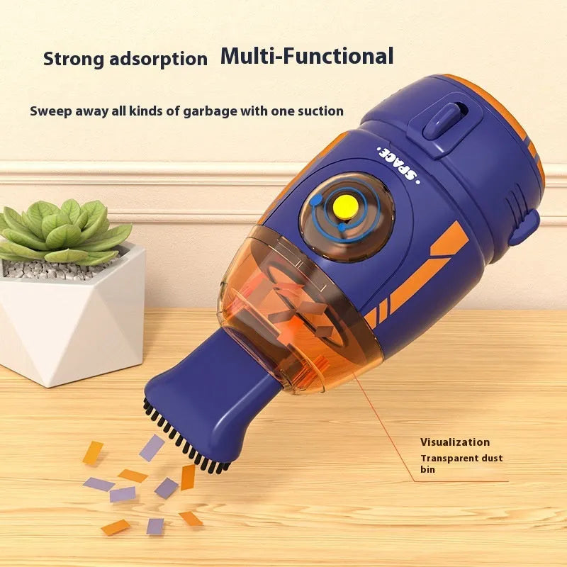 Handheld USB rechargeable desktop vacuum cleaner in a choice of rocket or animal designs on a desk.