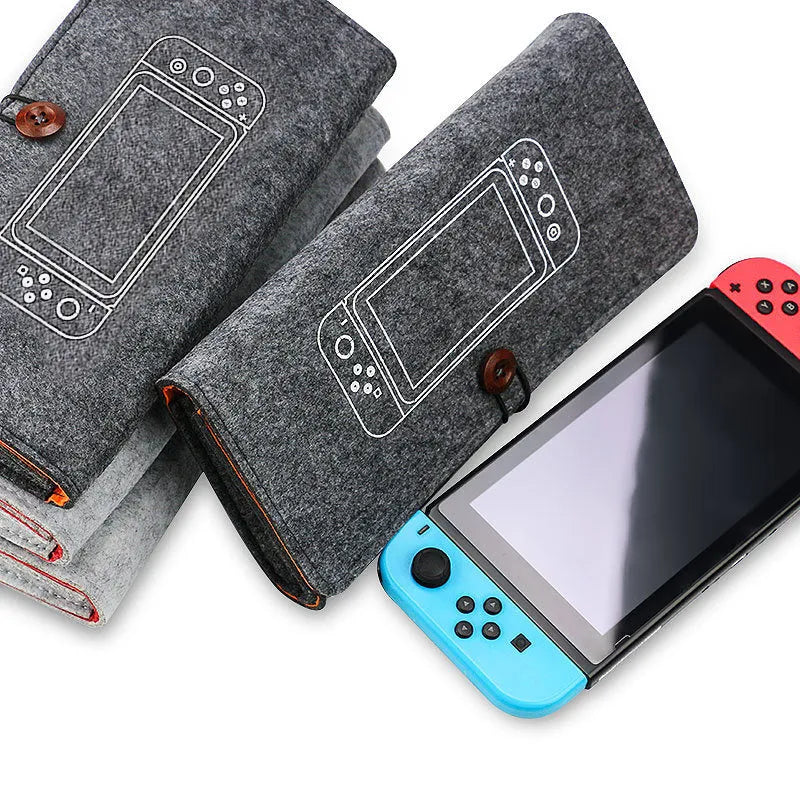 Black felt Nintendo Switch pouch case open to show console compartment and game card slots