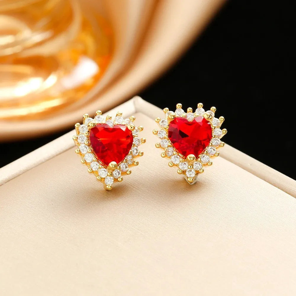 Gold-red titanium steel jewellery set with heart and flower pendant, matching earrings, and ring